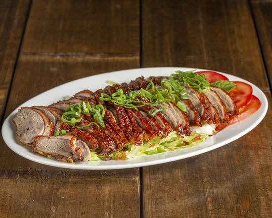 Crispy roasted duck on bed of cabbage